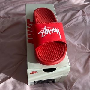 Selling Stussy x Nike slides in Habanero Red
